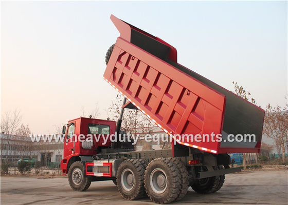 Sinotruk howo heavy duty loading mining dump truck for big rocks in wet mining road supplier