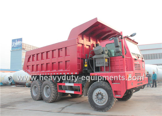 Sinotruk howo heavy duty loading mining dump truck for big rocks in wet mining road supplier